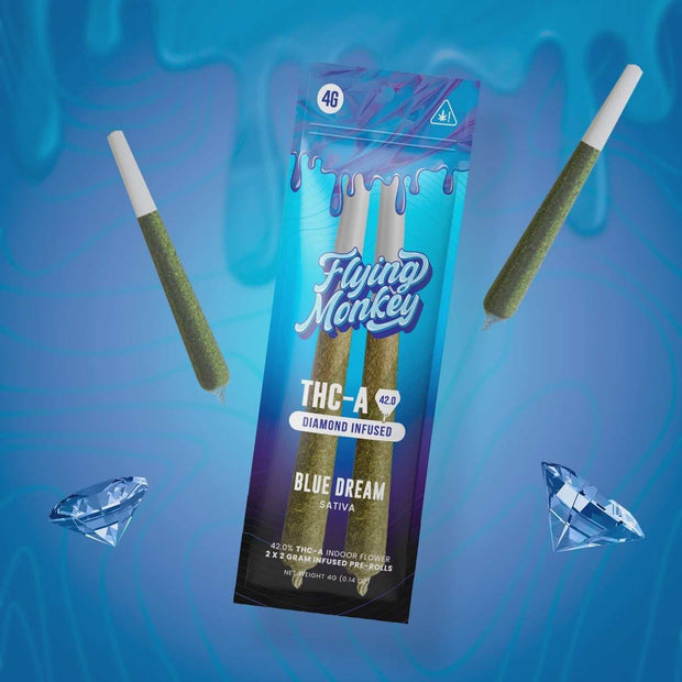 Flying Monkey Diamond Infused Pre-Rolls in a blue and purple Blue Dream pack, with two green pre-rolls and diamond graphics