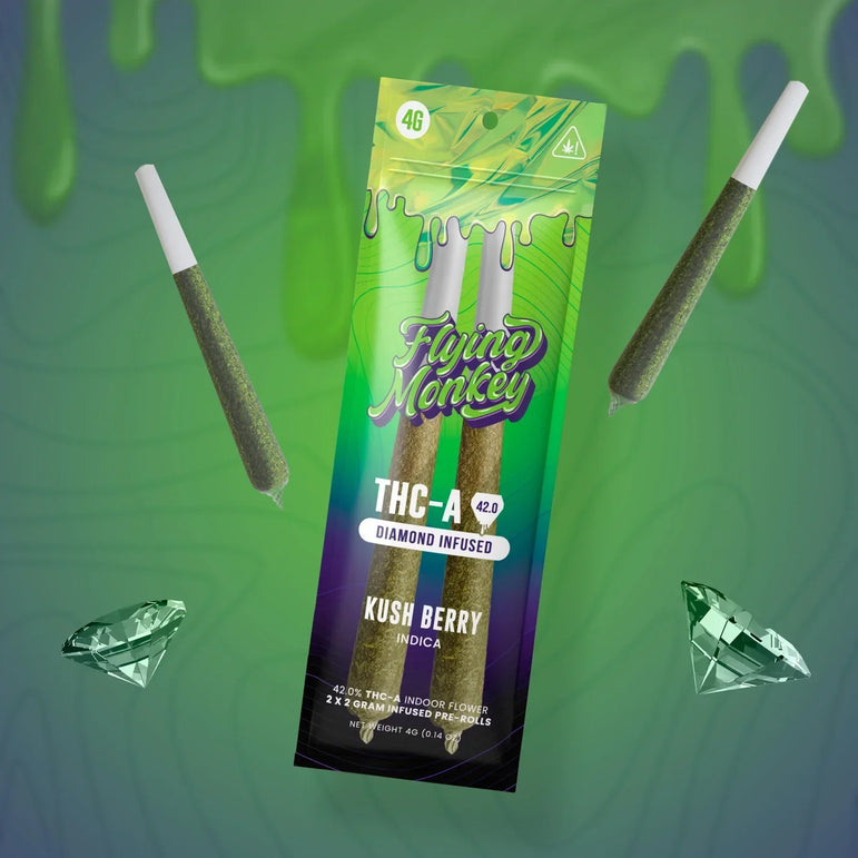 Flying Monkey Diamond Infused Pre-Rolls in a green and purple TAC-A package, with two brown pre-rolls and diamond graphics