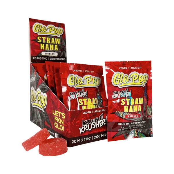 Glo POP Kube Krushers THC Gummies in red strawberry-banana packets, with two sugar-coated red gummies visible