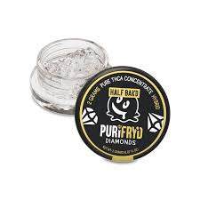 Half Bak'd PuriFryd THCA diamond sauce concentrate in a clear glass jar with a round black and yellow label