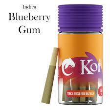 Koi THCa Kief-Infused mini pre-rolls in an orange jar with a purple lid, labeled Indica Blueberry Gum, beside a pre-roll.