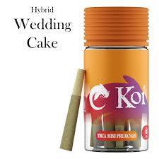 Koi THCa Kief-Infused mini pre-rolls in a tan paper wrap beside an orange jar with a Wedding Cake label