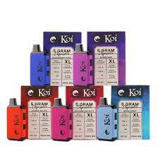 Koi XL THC Disposable vape devices in blue, pink, red and light blue with printed 5 gram labels and compact rectangular bodies