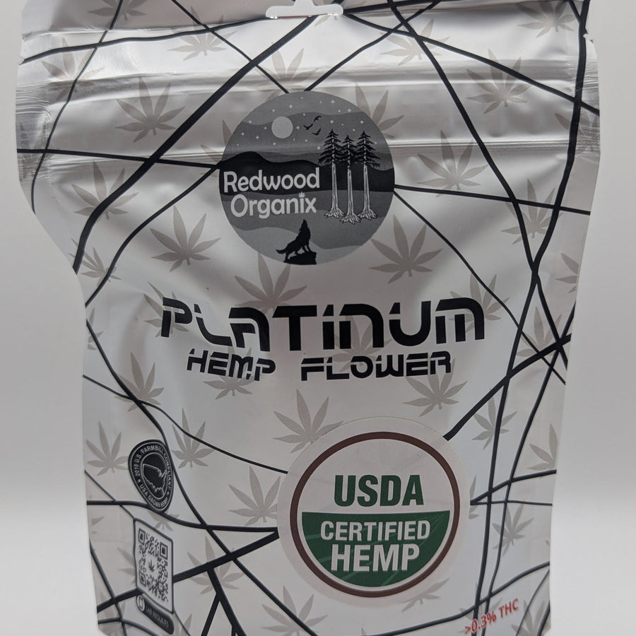 Redwood Organix Flower(s) in a white resealable pouch with black geometric lines, leaf motifs, and USDA Certified Hemp label