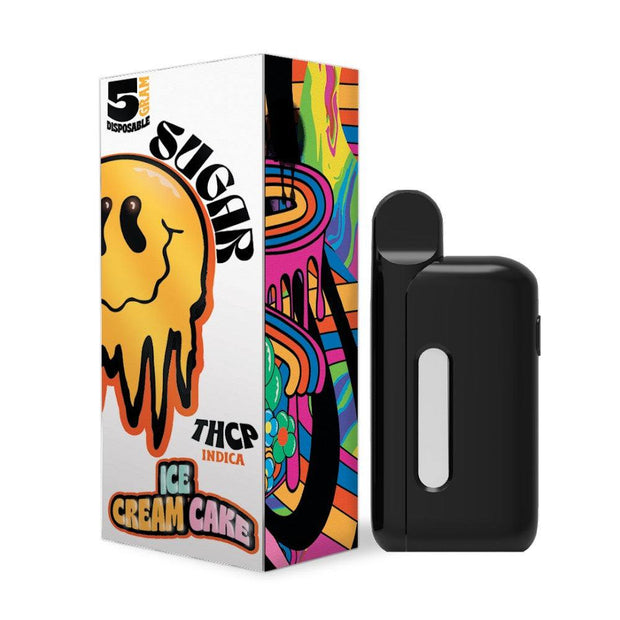 Sugar Trippy THCP Disposable(s) in a black rechargeable vape device beside colorful Ice Cream Cake strain packaging